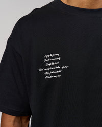 Man wearing Hype Heavyweight Unisex Oversized Tee - Black-White | Model:Xavier | Size:L