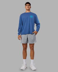 Man wearing Inferno Journey FLXCotton Oversized Long Sleeve Tee - Midnight Blue-Blue Bird | Model:Jackson | Size:L