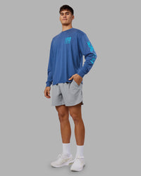 Man wearing Inferno Journey FLXCotton Oversized Long Sleeve Tee - Midnight Blue-Blue Bird | Model:Jackson | Size:L