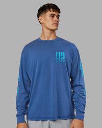 Man wearing Inferno Journey FLXCotton Oversized Long Sleeve Tee - Midnight Blue-Blue Bird | Model:Jackson | Size:L