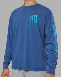 Man wearing Inferno Journey FLXCotton Oversized Long Sleeve Tee - Midnight Blue-Blue Bird | Model:Jackson | Size:L