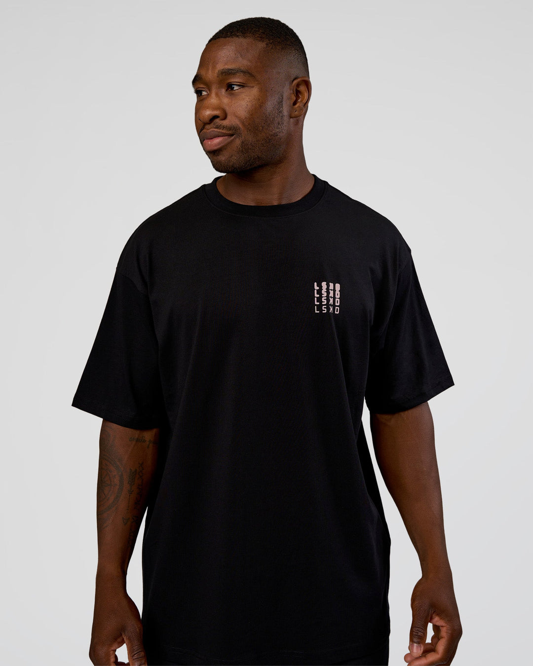 Man wearing Inferno Journey FLXCotton Oversized Tee - Black-Ultra Fuchsia | Model:Sam | Size:L