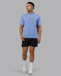 Man wearing Just Run FLXCotton Oversized Tee - Soft Blue-Dark Storm | Model:Kaelyb | Size:L