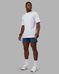 Man wearing Lift 6" Short - Indigo | Model:Sam | Size:L