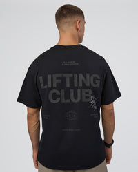 Man wearing Lifting Club FLXCotton Tee Oversize - Black-Black | Model:Nikola | Size:L