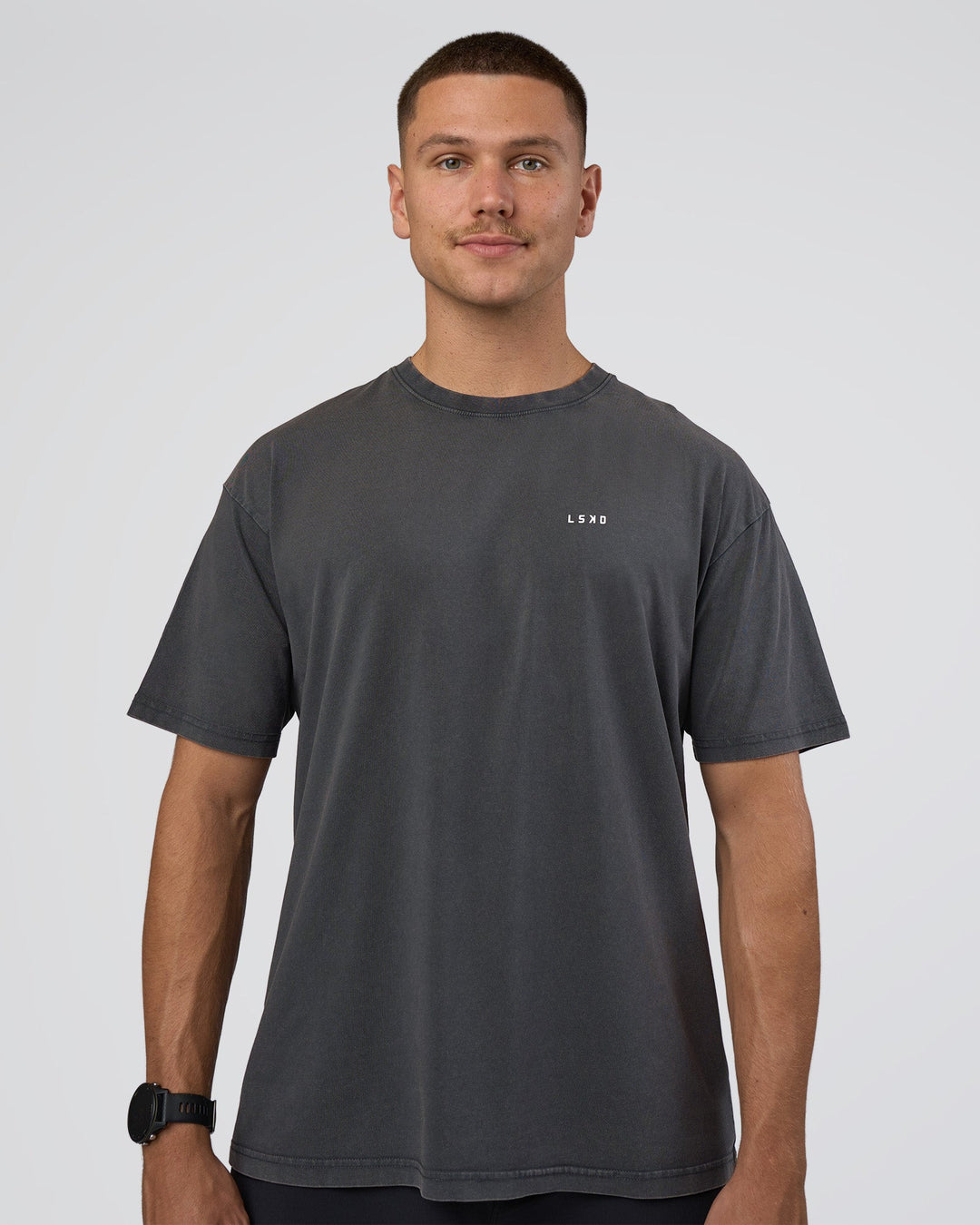 Man wearing Lifting FLXCotton Oversized Tee - Black Washed-Flame | Model:Nikola | Size:L