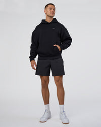 Man wearing Lifting Unisex Oversized Hoodie - Black-Flame| Model:Nikola | Size:L