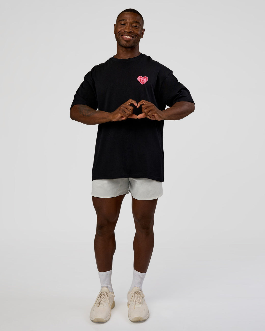Man wearing Love the Journey FLXCotton Oversized Tee - Black-Flame | Model:Sam | Size:L