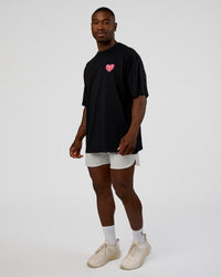 Man wearing Love the Journey FLXCotton Oversized Tee - Black-Flame | Model:Sam | Size:L
