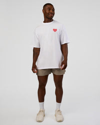 Man wearing Love the Journey FLXCotton Oversized Tee - White-Candy Pink | Model:Sam | Size:L