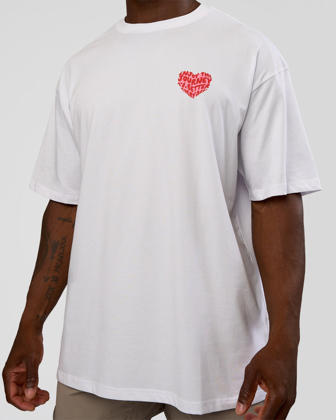 Man wearing Love the Journey FLXCotton Oversized Tee - White-Candy Pink | Model:Sam | Size:L