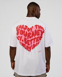 Man wearing Love the Journey FLXCotton Oversized Tee - White-Candy Pink | Model:Sam | Size:L
