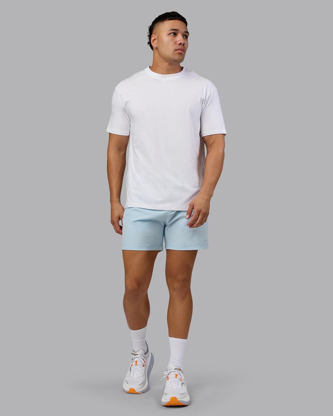 Man wearing Love The Run FLXCotton Tee Oversize - White-Dark Moss | Model:Kaelyb | Size:L