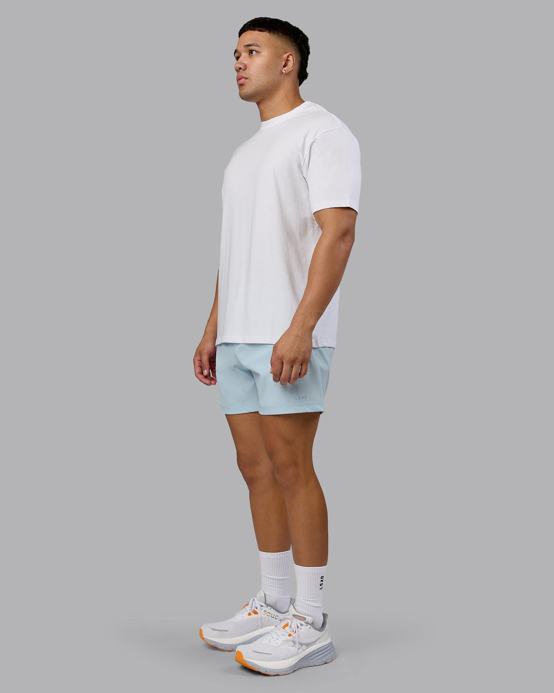 Man wearing Love The Run FLXCotton Tee Oversize - White-Dark Moss | Model:Kaelyb | Size:L