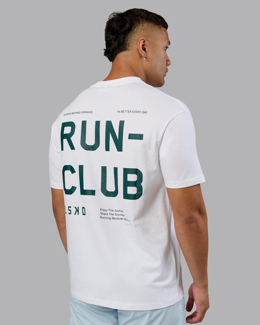 Man wearing Love The Run FLXCotton Tee Oversize - White-Dark Moss | Model:Kaelyb | Size:L