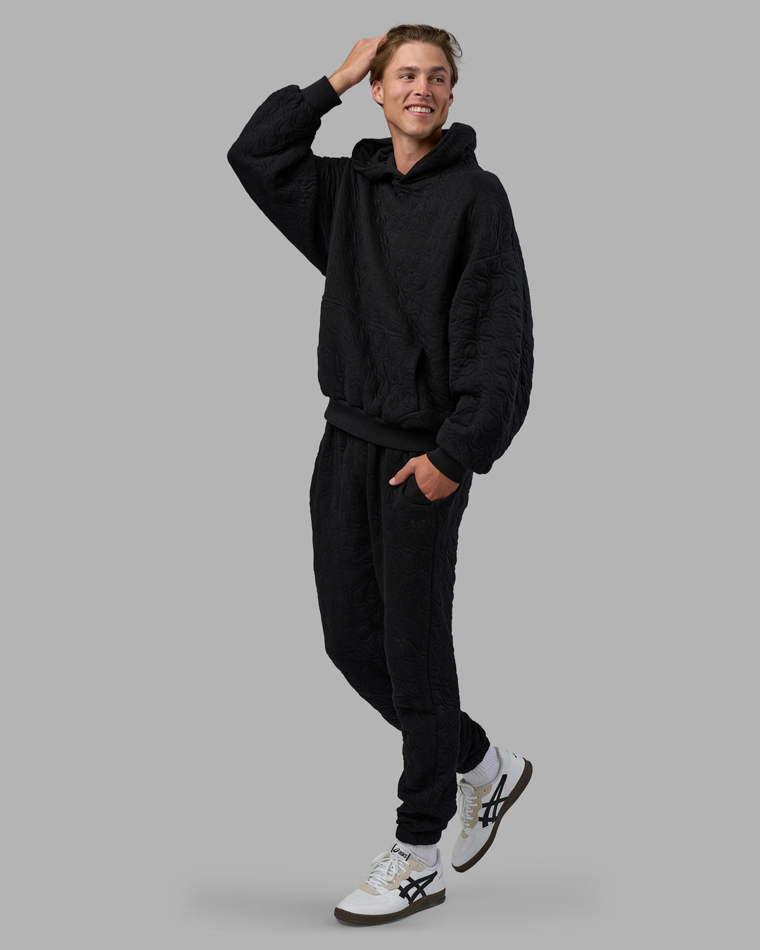 Man wearing MVP Quilted Oversized Hoodie - Black-Geometric | Model:Brandon | Size:L