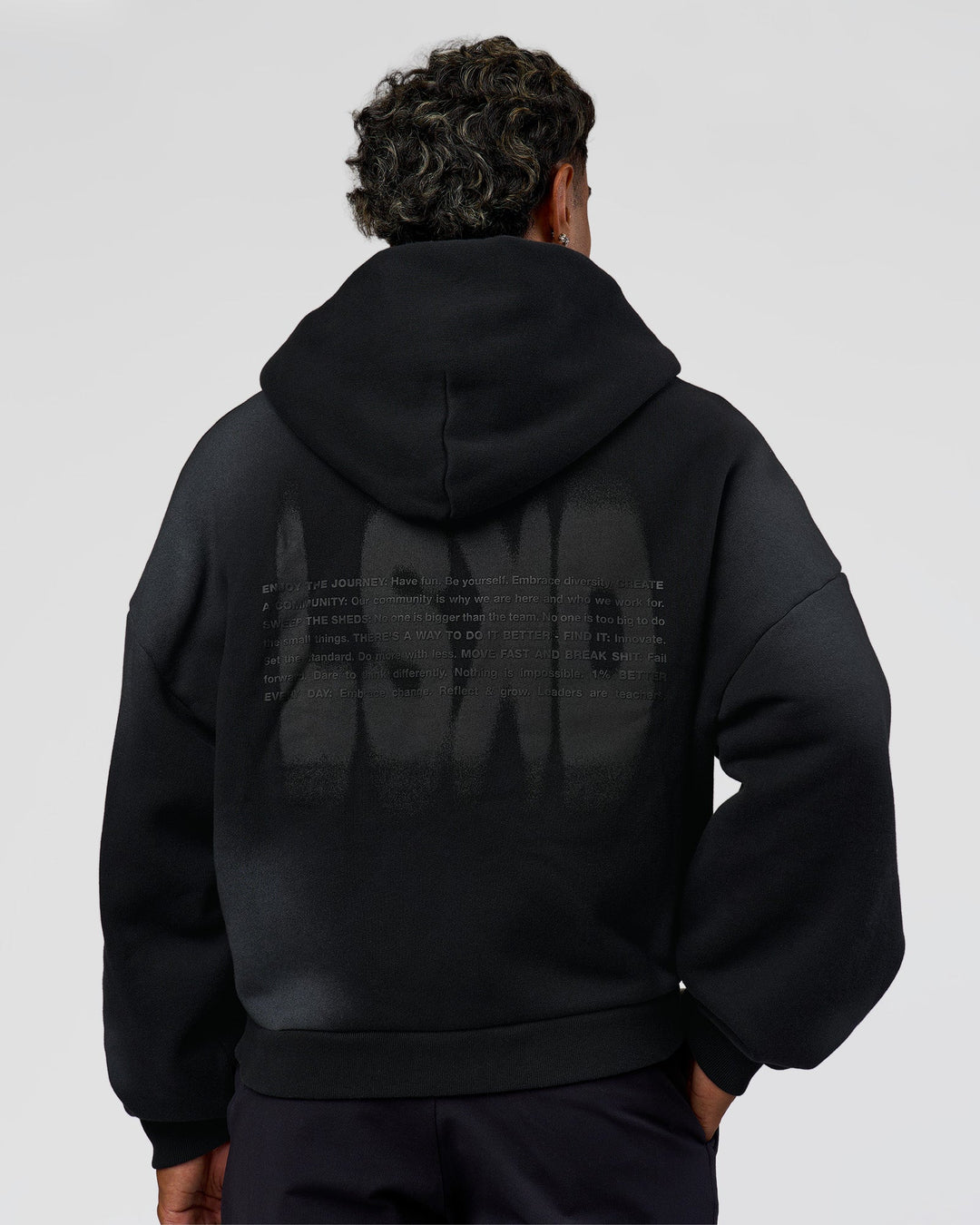 Man wearing Memory in Motion Ultra Heavyweight Zip Thru Hoodie - Black Washed | Model:Xav | Size:L