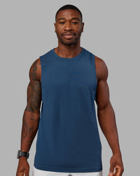 Woman wearing AeroFLX+ Seamless Muscle Tank - Indigo | Model:Sam | Size:L
