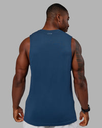Woman wearing AeroFLX+ Seamless Muscle Tank - Indigo | Model:Sam | Size:L