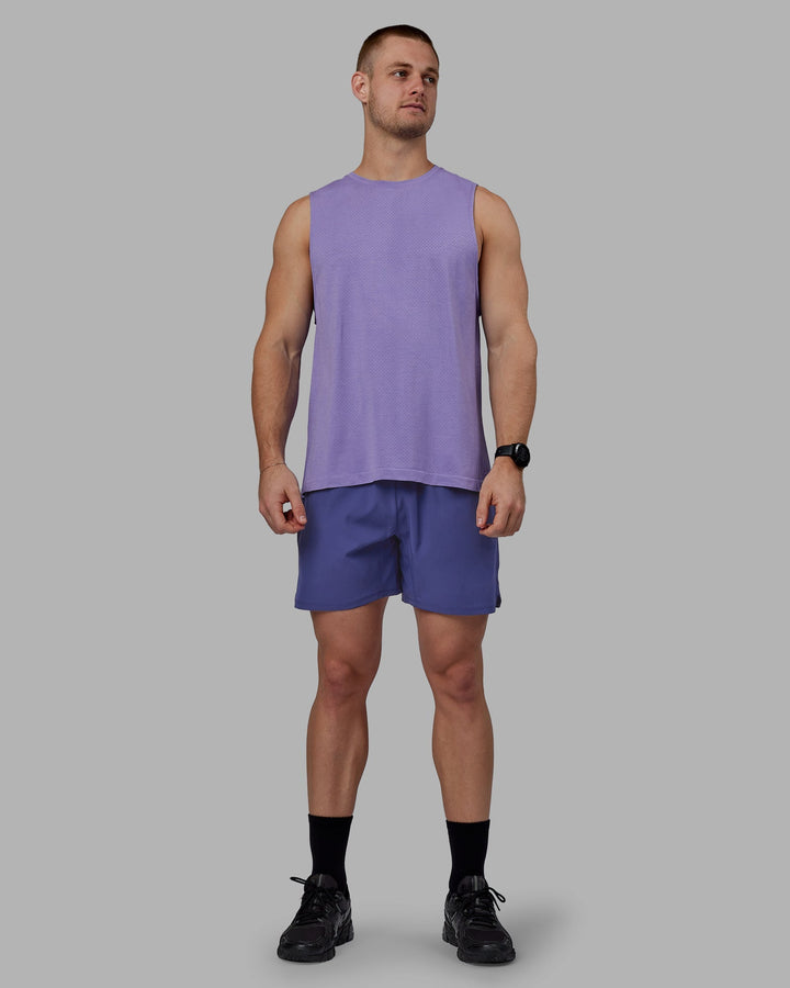 Man wearing AeroFLX+ Seamless Muscle Tank - Dahlia Purple Marl
