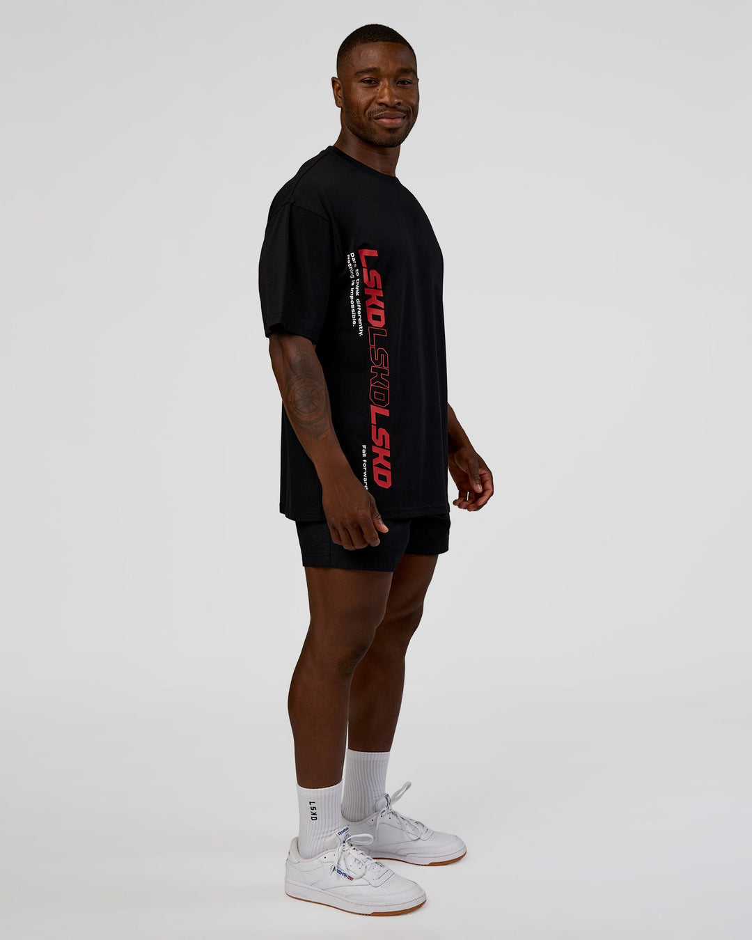 Man wearing Nothing Is Impossible FLXCotton Oversized Tee - Black-Flame | Model:Sam | Size:L