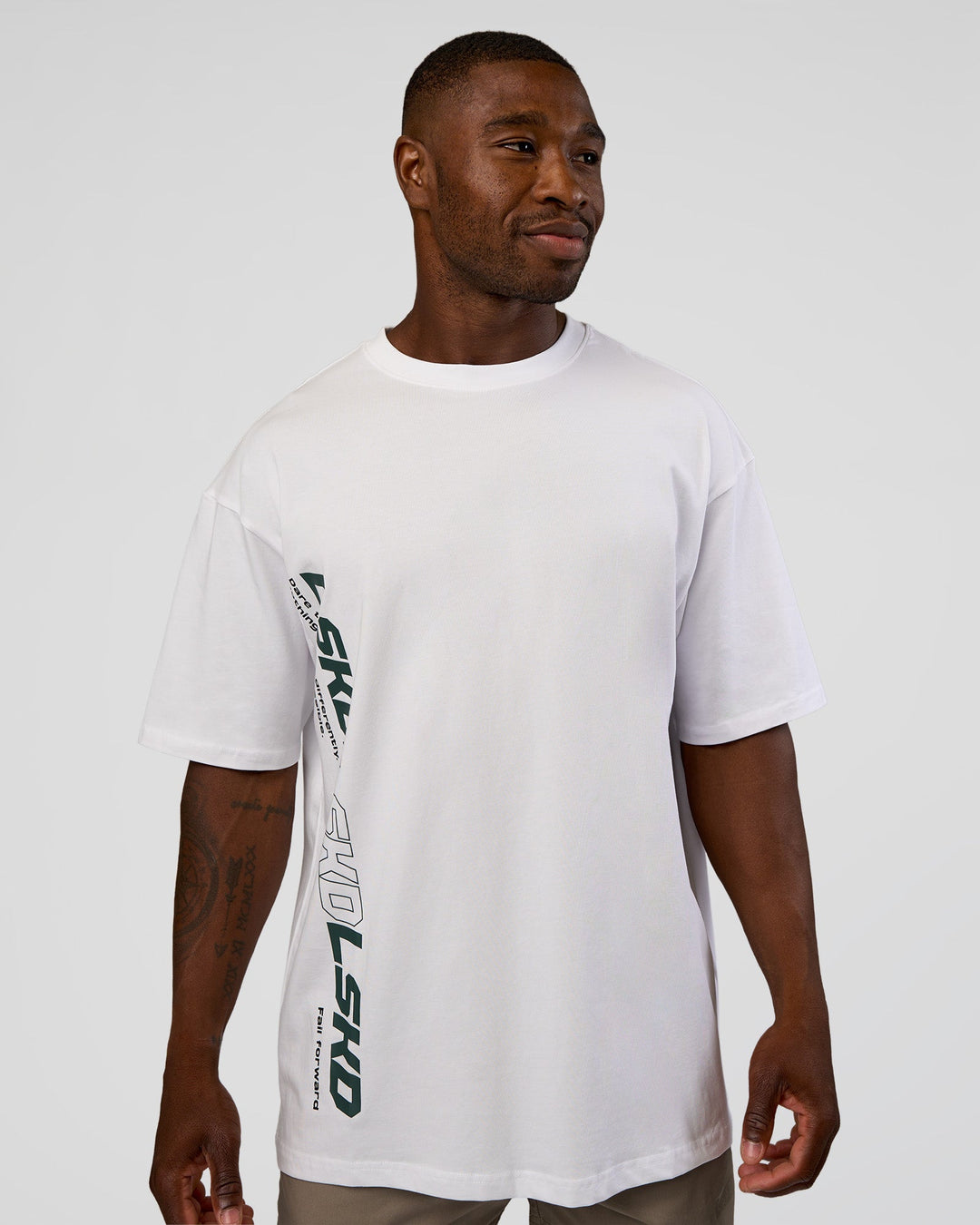 Man wearing Nothing Is Impossible FLXCotton Oversized Tee - White-Vital Green | Model:Sam | Size:L