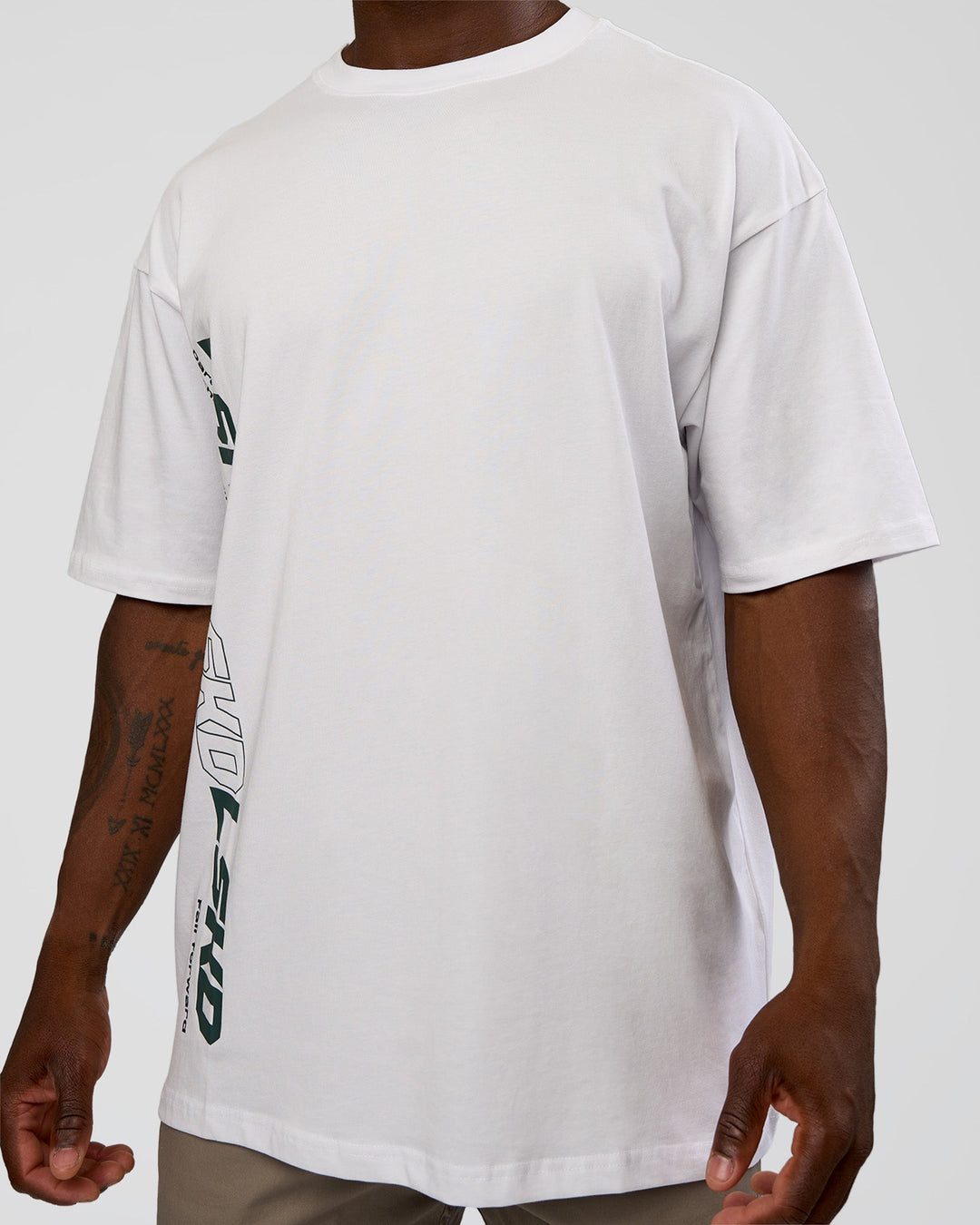 Man wearing Nothing Is Impossible FLXCotton Oversized Tee - White-Vital Green | Model:Sam | Size:L