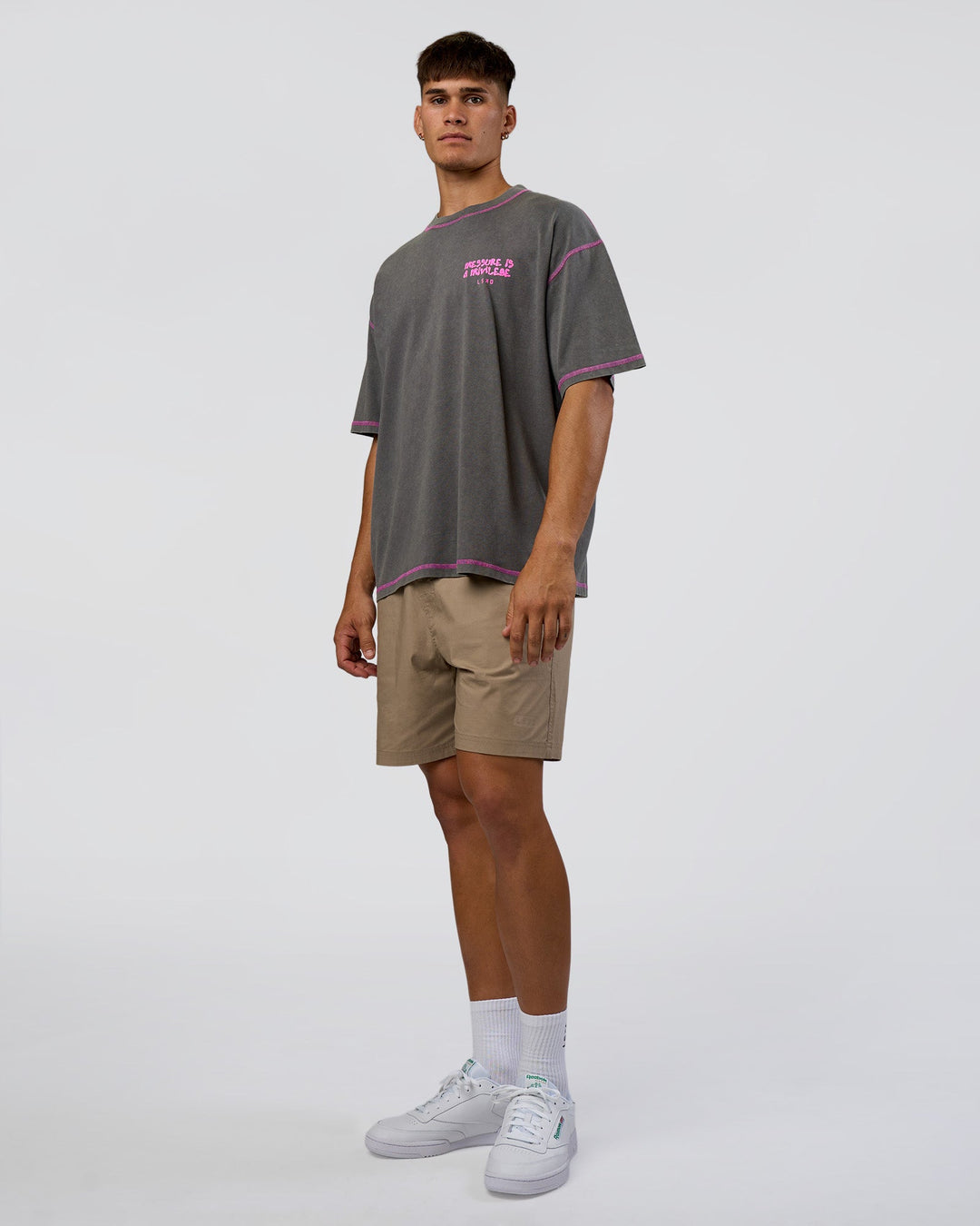 Man wearing Pressure is Privilege Oversized Tee - Dark Storm Washed-Ultra Fuchsia | Model:Jackson | Size:L