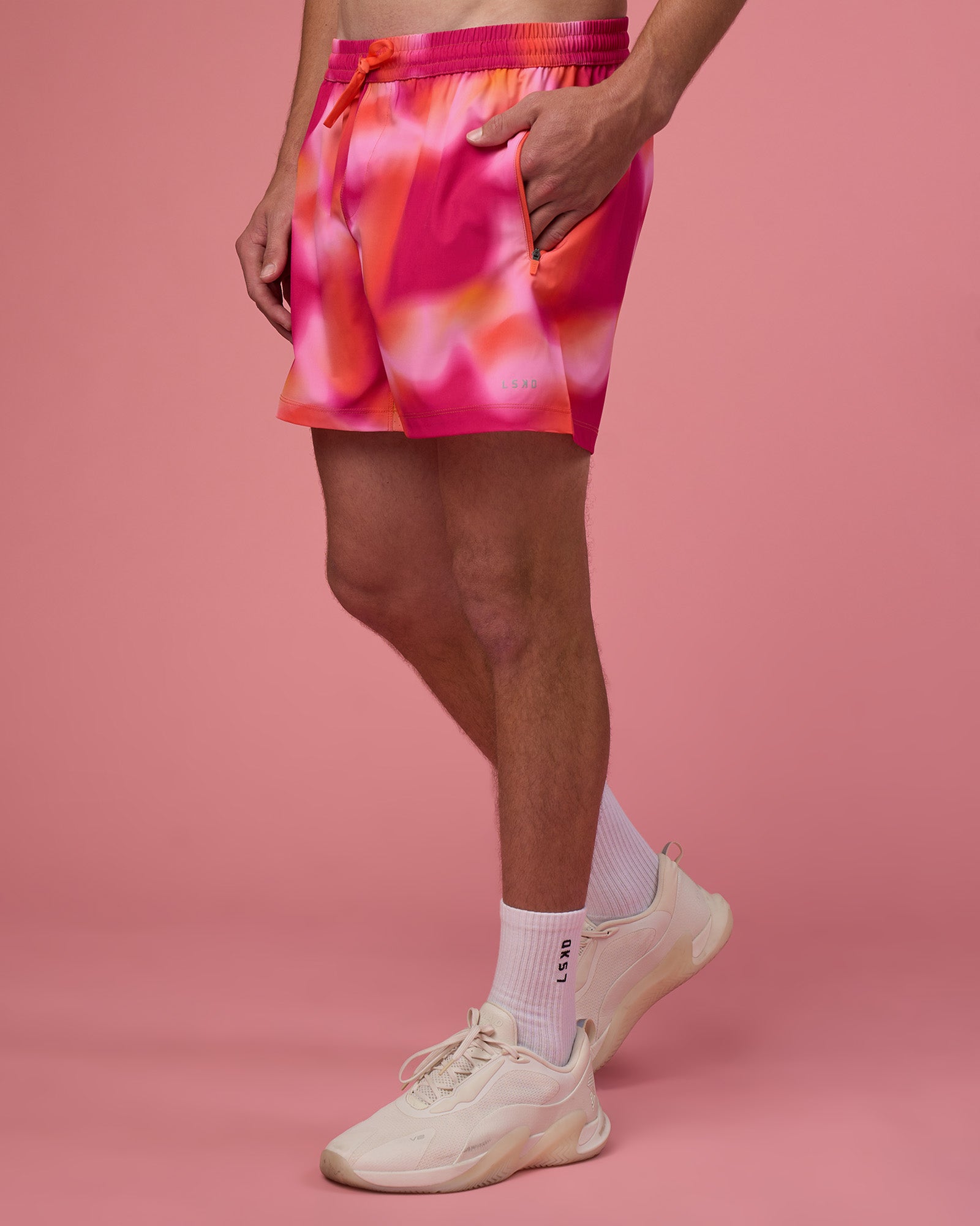 Man wearing Rep 5" Performance Short - Pink Glow Print | Model:Brandon | Size:L