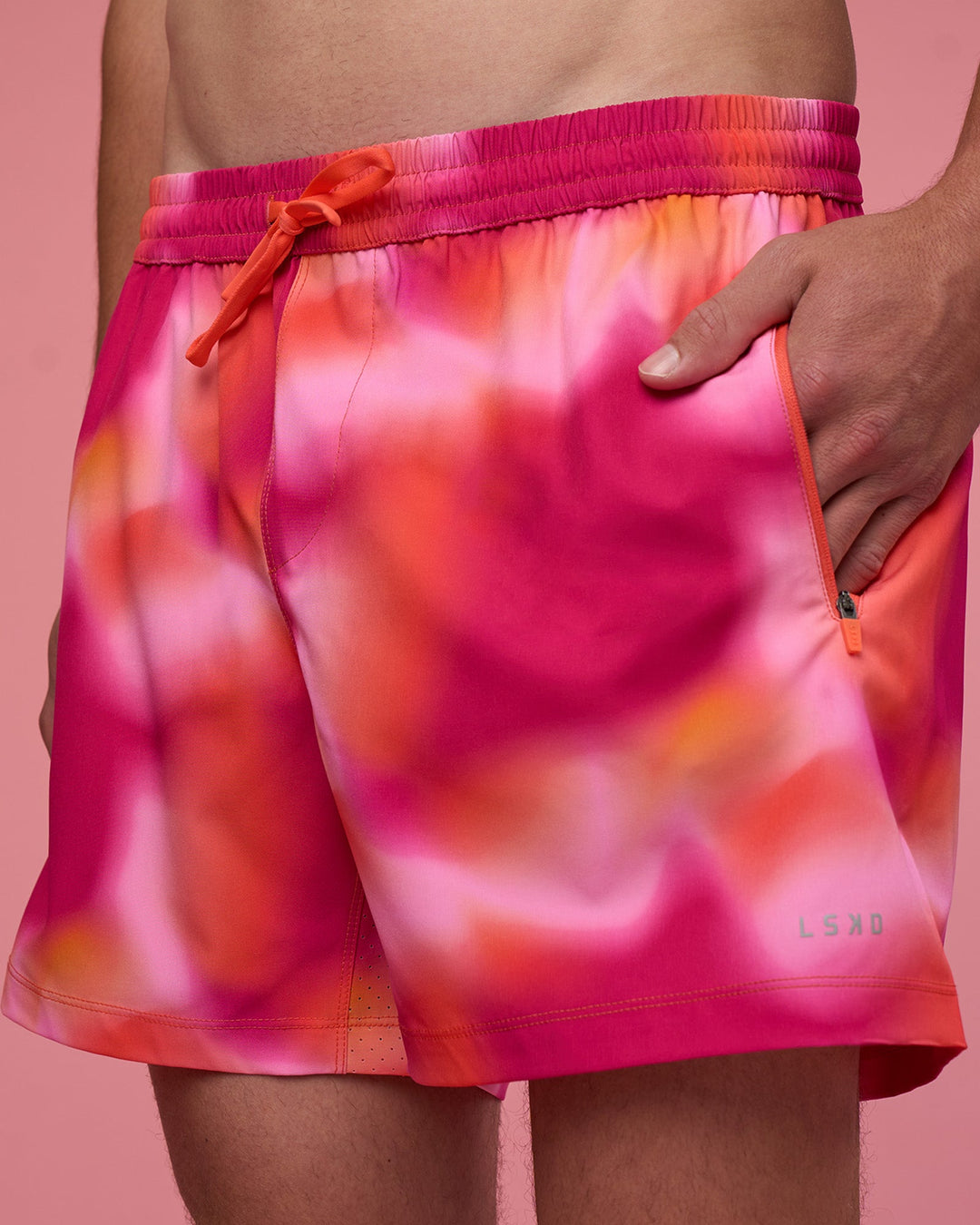 Man wearing Rep 5&quot; Performance Short - Pink Glow Print | Model:Brandon | Size:L
