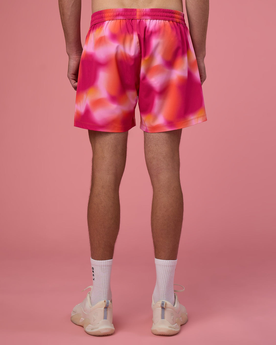 Man wearing Rep 5&quot; Performance Short - Pink Glow Print | Model:Brandon | Size:L