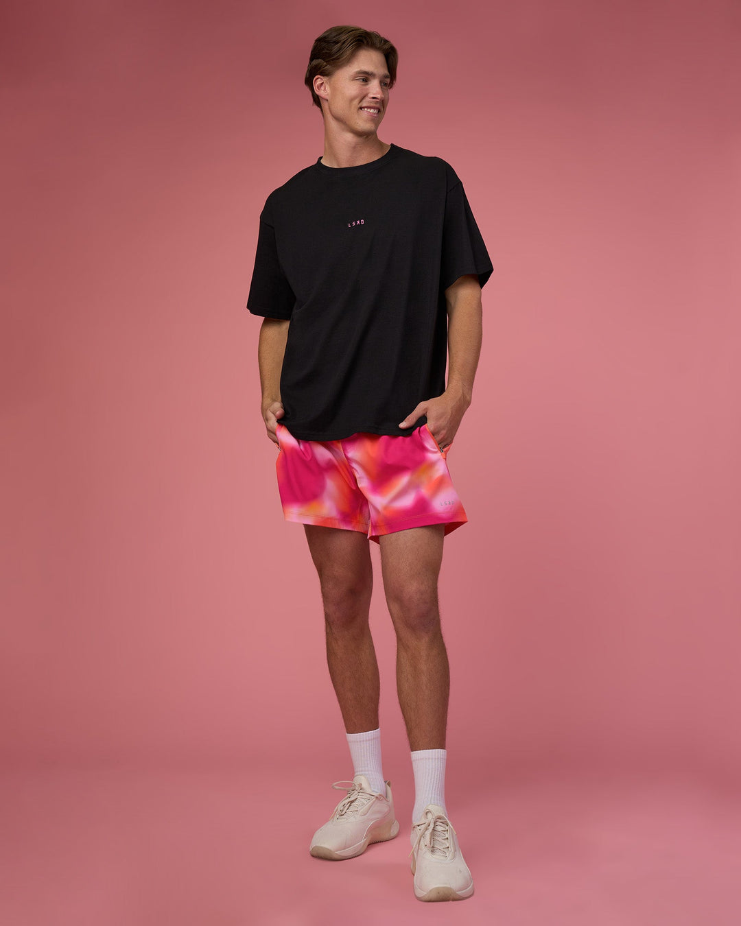 Man wearing Rep 5&quot; Performance Short - Pink Glow Print | Model:Brandon | Size:L