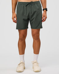Man wearing Rep 7'' Performance Short - Carbon Green | Model:Liam | Size:L