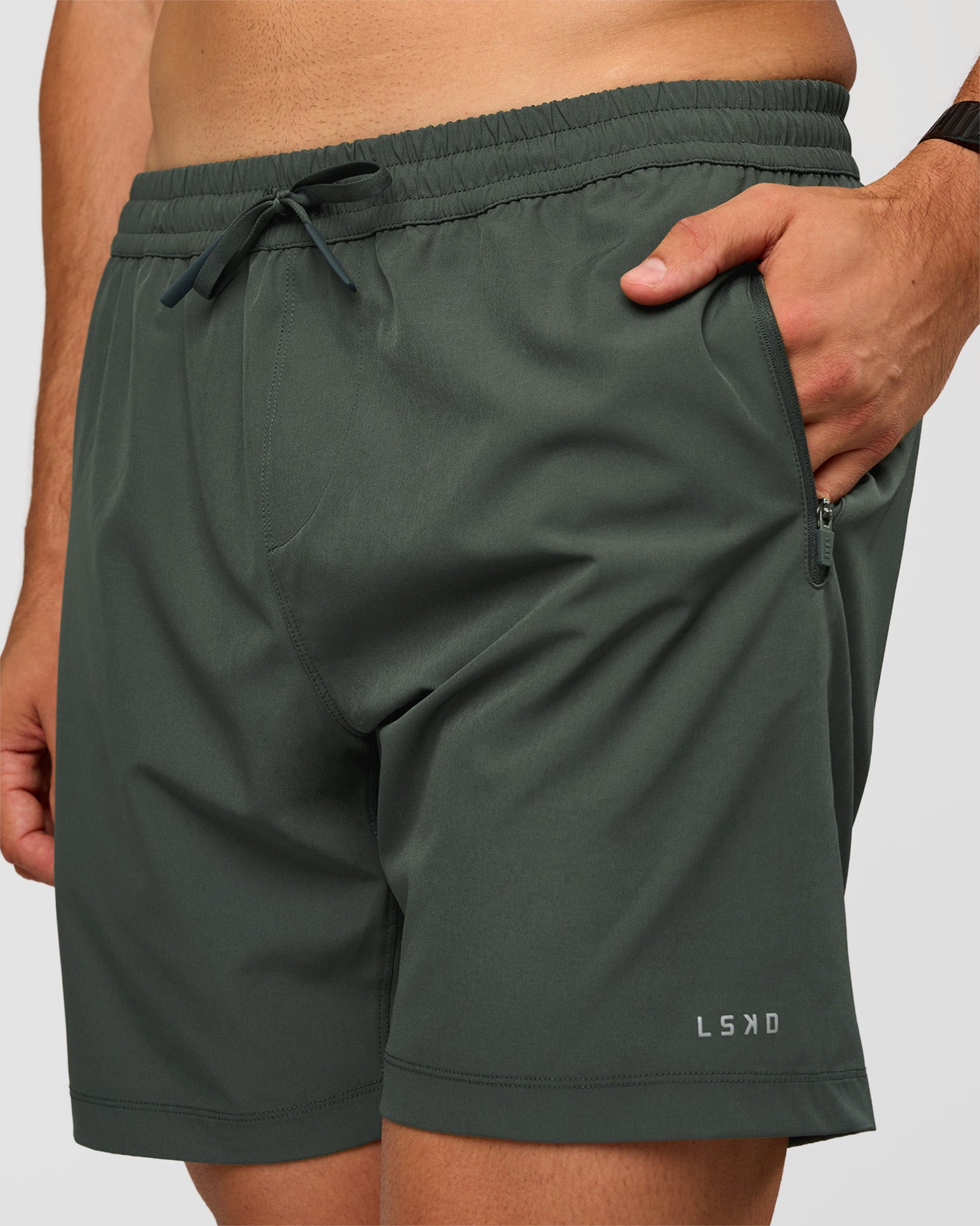 Man wearing Rep 7'' Performance Short - Carbon Green | Model:Liam | Size:L