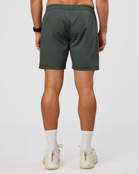 Man wearing Rep 7'' Performance Short - Carbon Green | Model:Liam | Size:L