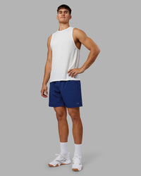 Man wearing Rep 7'' Performance Short - Midnight Blue | Model:Jackson | Size:L