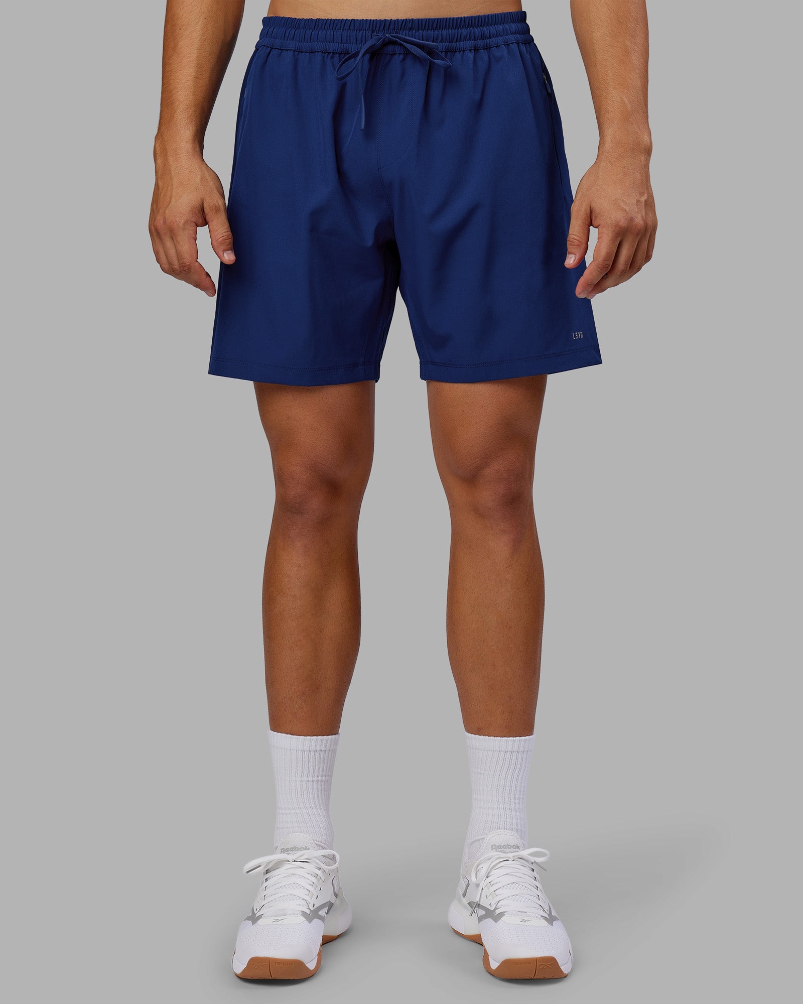 Man wearing Rep 7'' Performance Short - Midnight Blue | Model:Jackson | Size:L