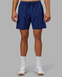 Man wearing Rep 7'' Performance Short - Midnight Blue | Model:Jackson | Size:L