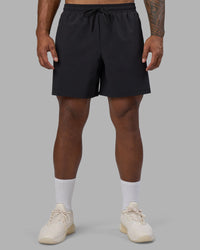 Man wearing Rep TRD Ripstop 7" Training Short - Black | Model:Xav | Size:L