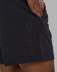 Man wearing Rep TRD Ripstop 7" Training Short - Black | Model:Xav | Size:L