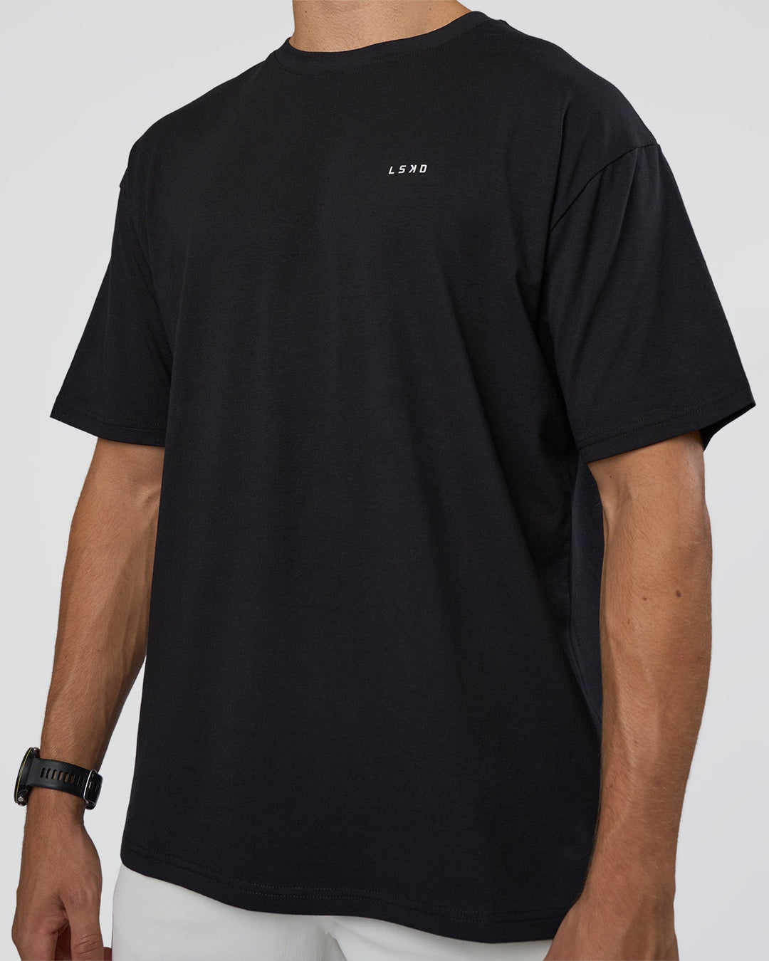 Man wearing Research Department FLXCotton Oversized Tee - Black | Model:Nikola | Size:L