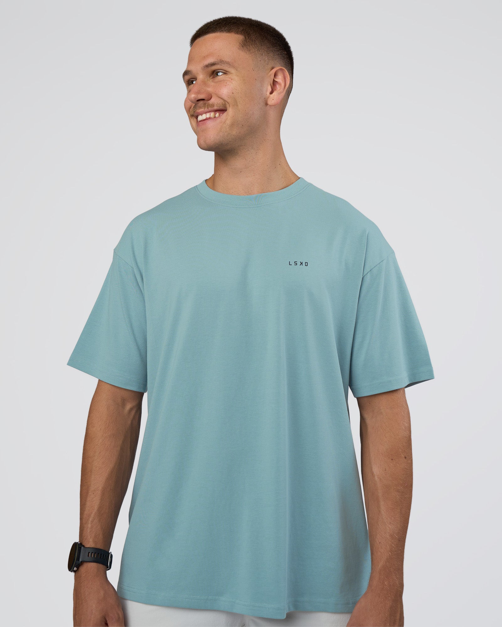 Man wearing Research Department FLXCotton Oversized Tee - Smoke Blue | Model:Nikola | Size:L