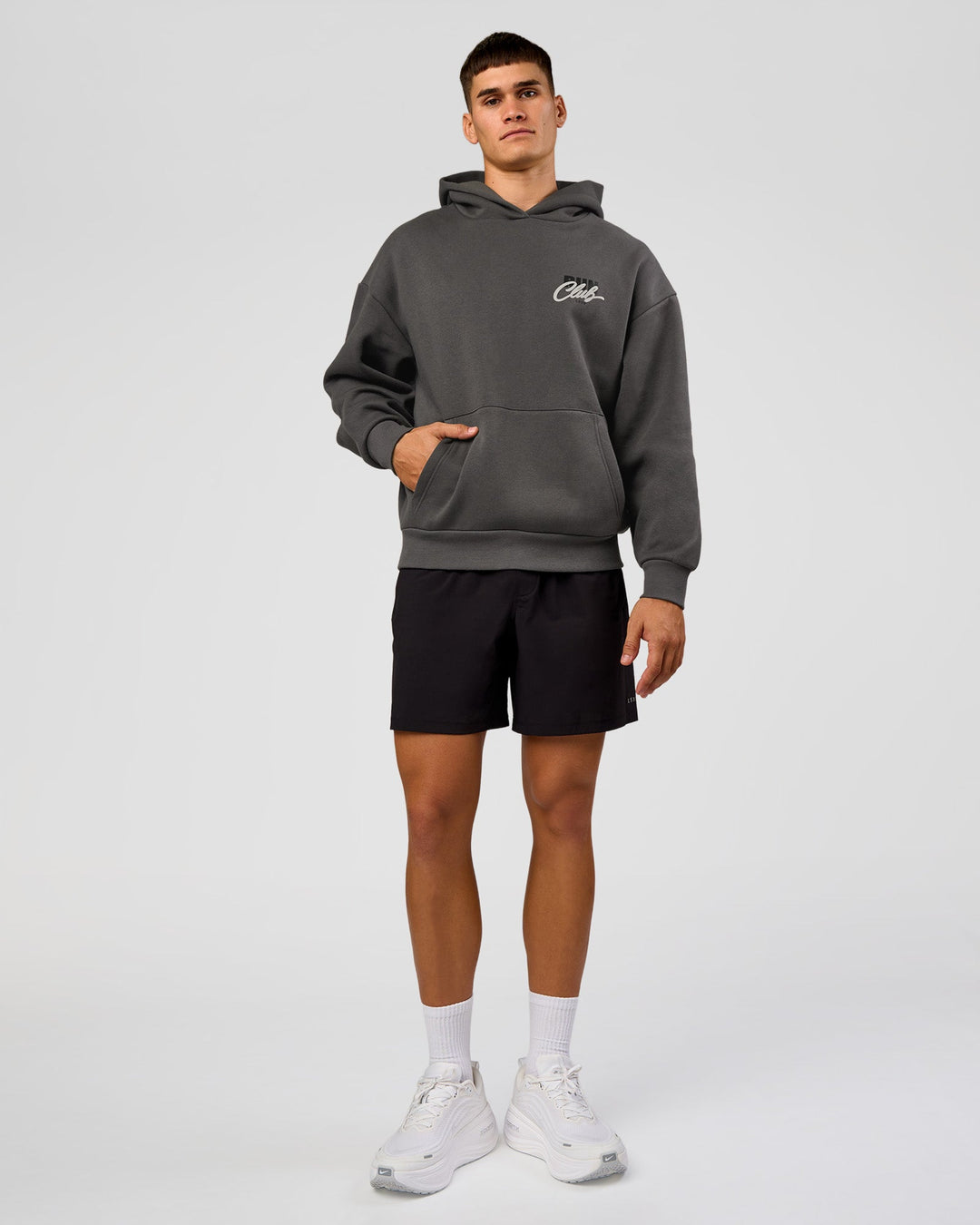 Man wearing Run Club Script Oversized Hoodie - Dark Storm-Alloy | Model:Jackson | Size:L