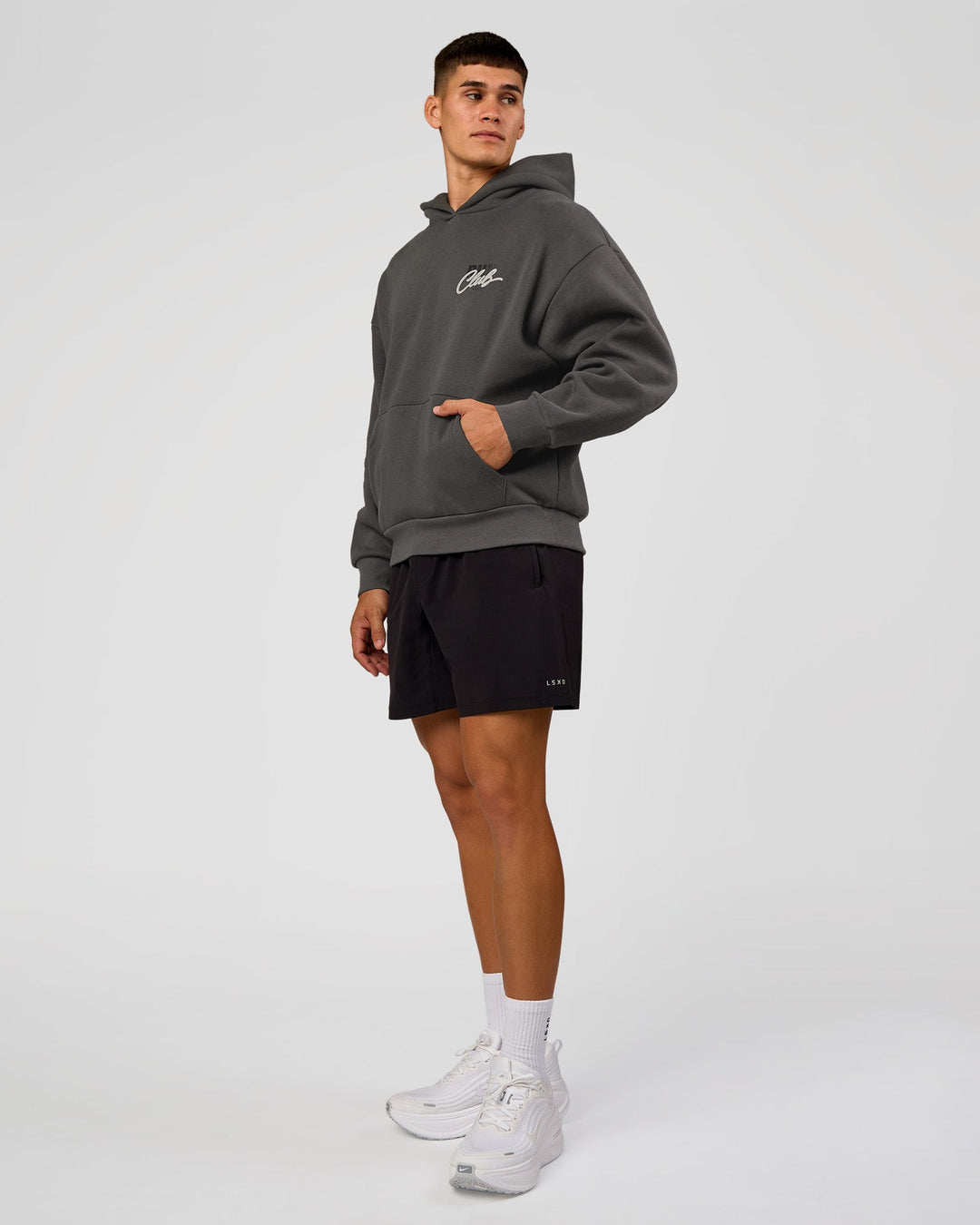 Man wearing Run Club Script Oversized Hoodie - Dark Storm-Alloy | Model:Jackson | Size:L