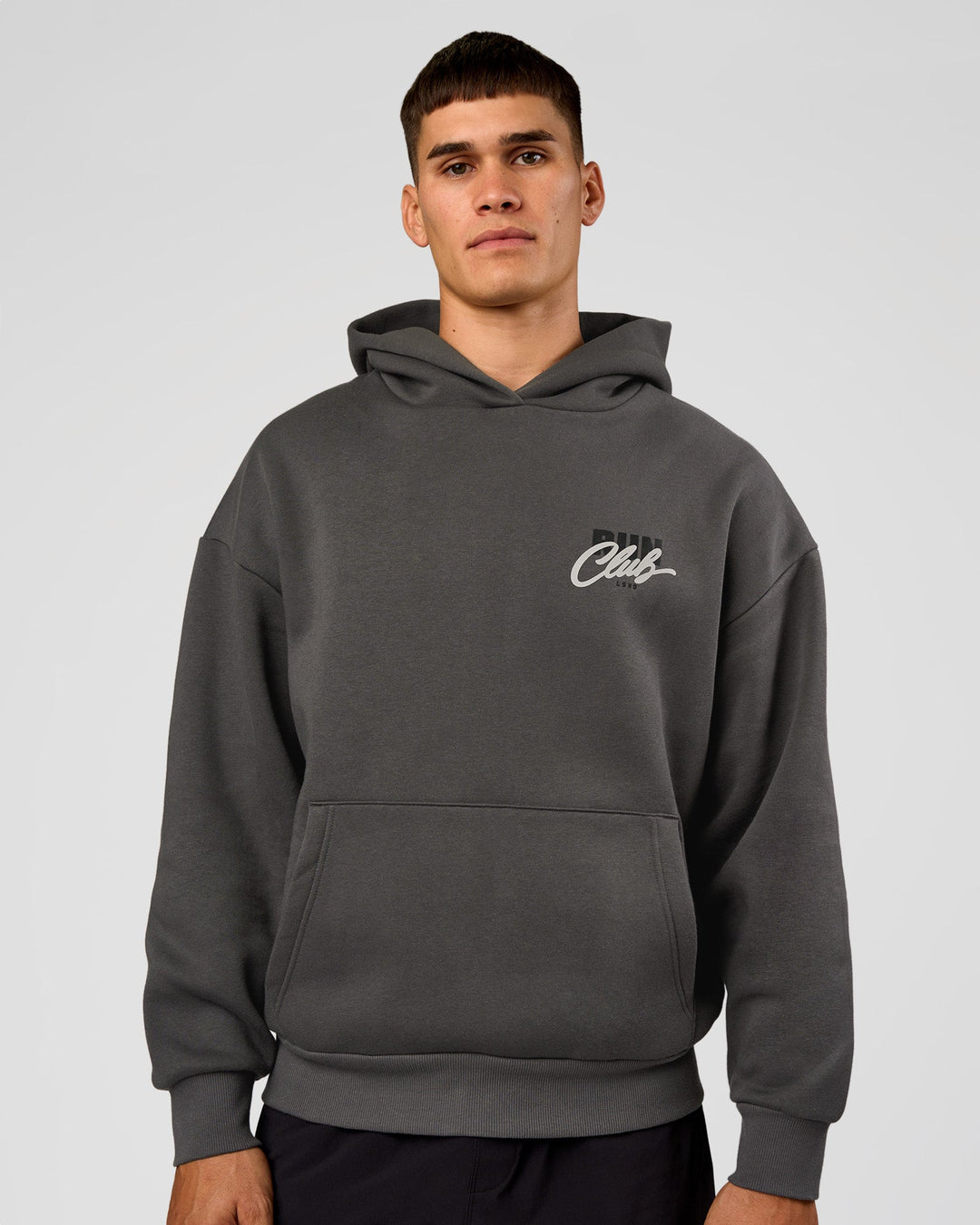 Man wearing Run Club Script Oversized Hoodie - Dark Storm-Alloy | Model:Jackson | Size:L