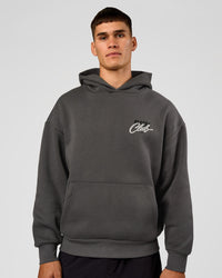 Man wearing Run Club Script Oversized Hoodie - Dark Storm-Alloy | Model:Jackson | Size:L