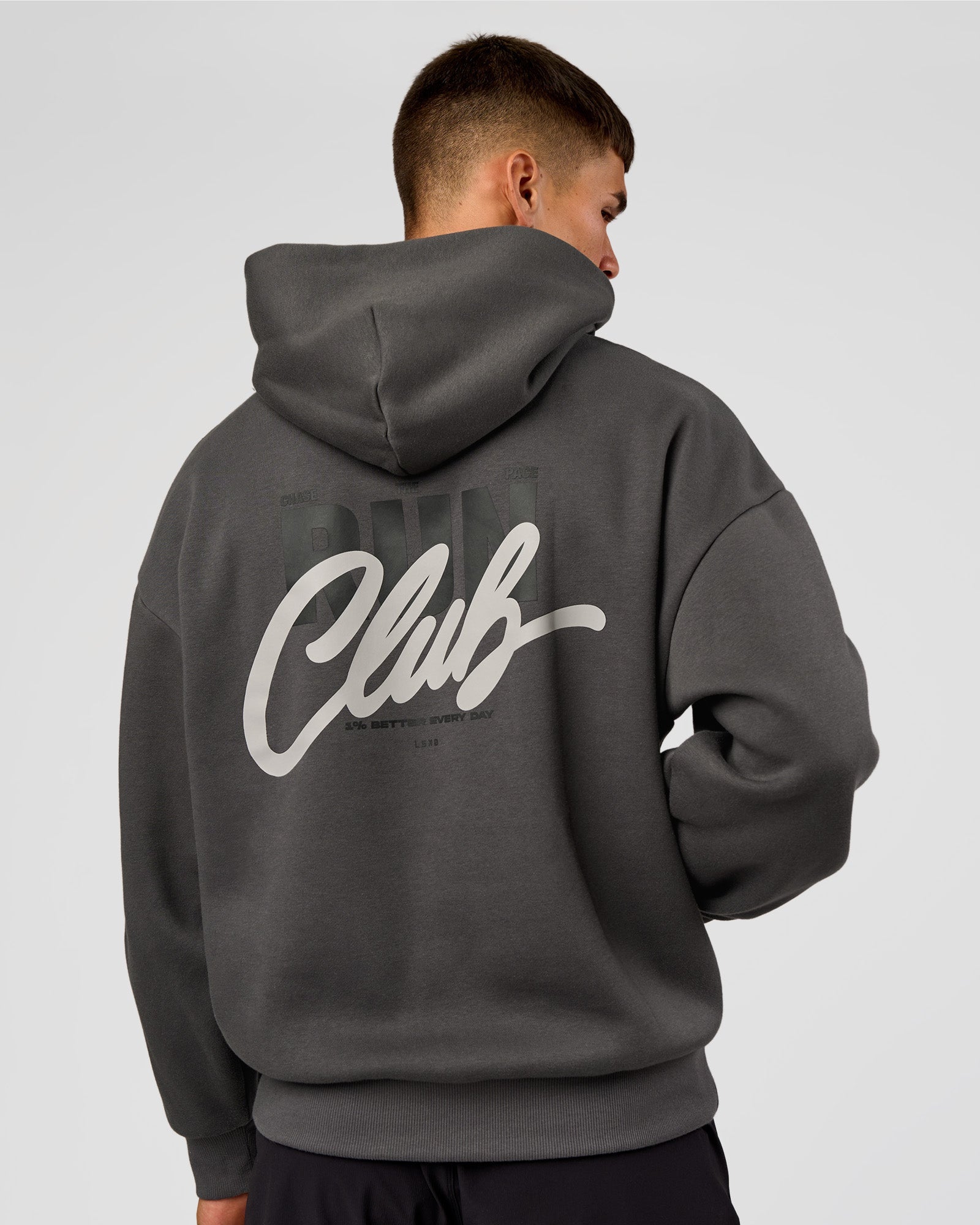 Man wearing Run Club Script Oversized Hoodie - Dark Storm-Alloy | Model:Jackson | Size:L