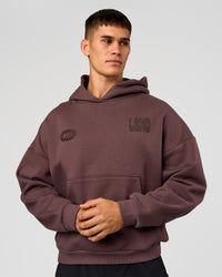 Man wearing Static Grit Unisex Boxy Hoodie - Cocoa Powder-Hot Chocolate | Model:Jackson | Size:L