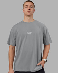 Man wearing Time's Up Heavyweight Oversized Tee - Circular Grey-White | Model:Tom | Size:L