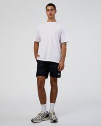 Man wearing Together We Rise FLXCotton Oversized Tee - White-Solar Lime | Model:Zoran | Size:L